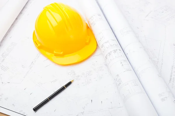 Blue print and safety helmet — Stock Photo, Image