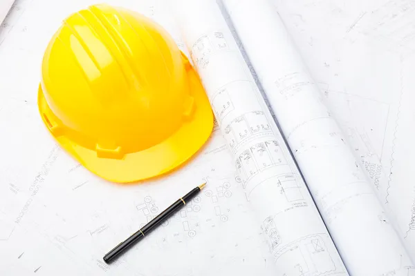 Blue print and safety helmet — Stock Photo, Image