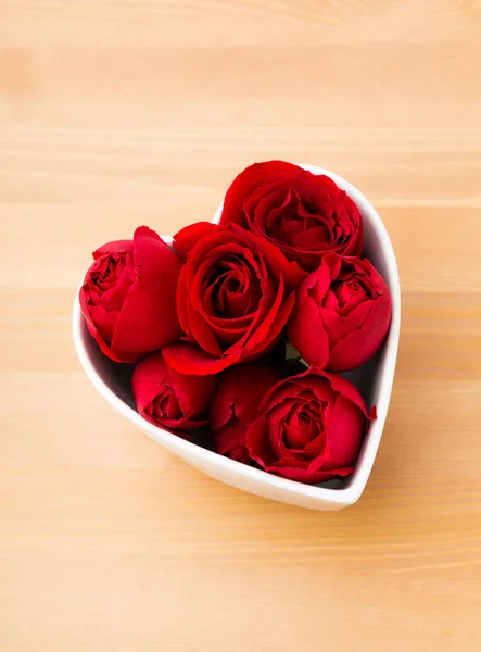 Rose in heart shape bowl — Stock Photo, Image