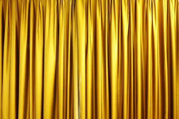 Large golden stage curtain — Stock Image Large golden stage curtain Stock Photo
