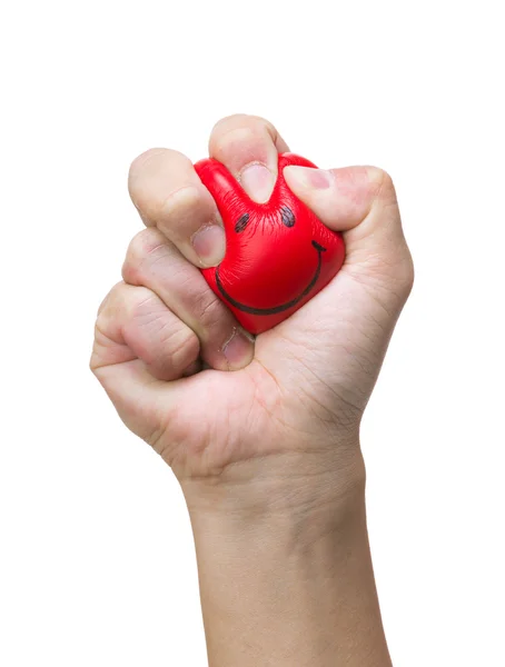 Hand squeezing smile face stress ball — Stock Photo, Image