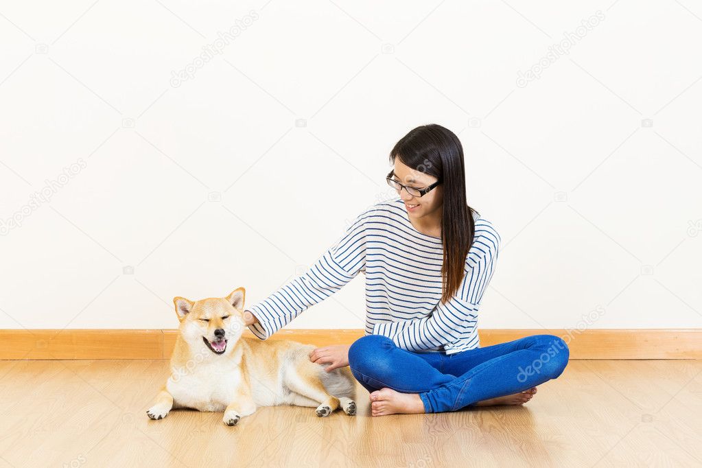 Asia woman with shiba at home
