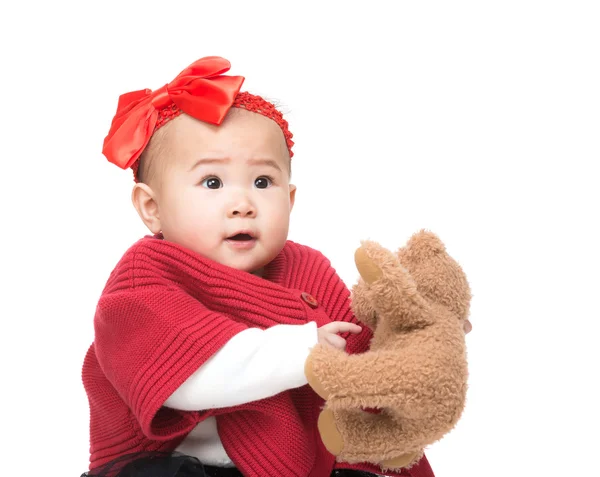 Азиатская девочка с куклой — стоковое фото