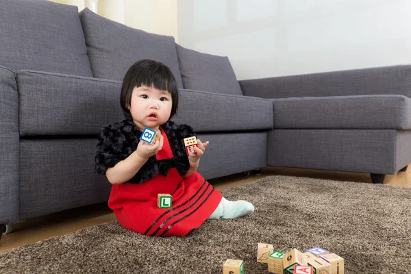 Baby girl play toy block — Stock Photo, Image