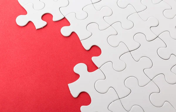 Incomplete puzzle with red missing part — Stock Photo, Image