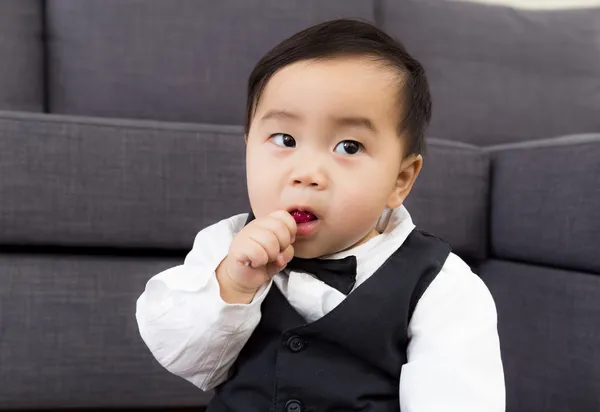 Baby sucking candy — Stock Photo, Image