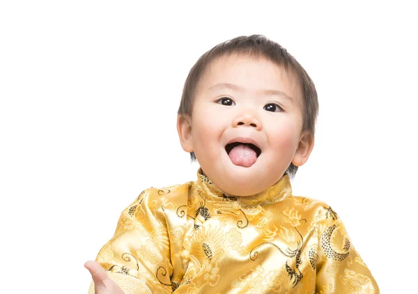 Menino chinês com traje tradicional língua shiowing — Fotografia de Stock