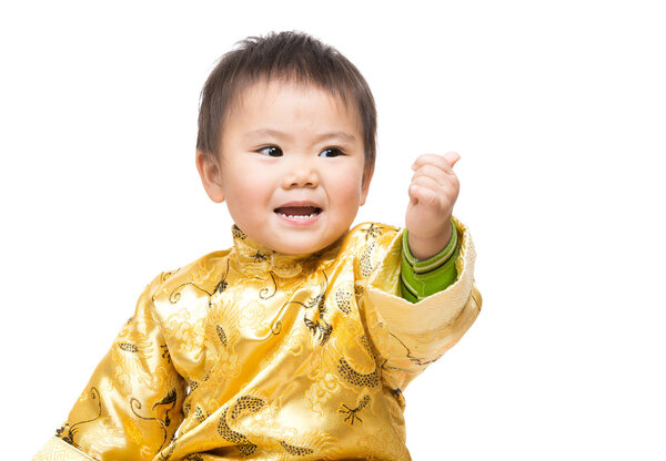 Chinese baby boy with traditional costume and thumb up