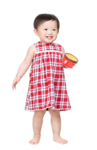 Baby Girl standing with snack box Stock Image