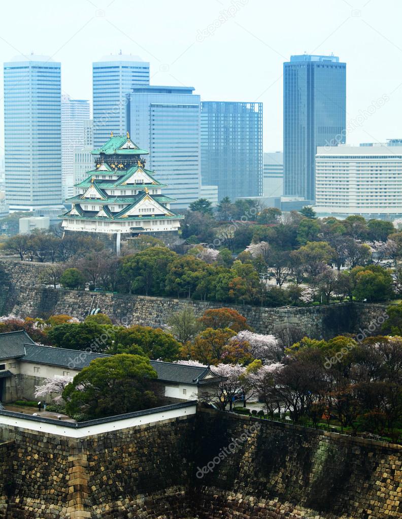 Osaka castle with modern building background
