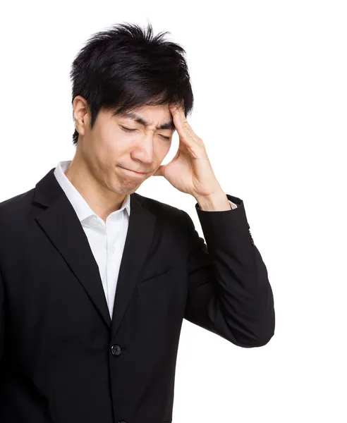 Asian businessman with headache — Stock Photo, Image