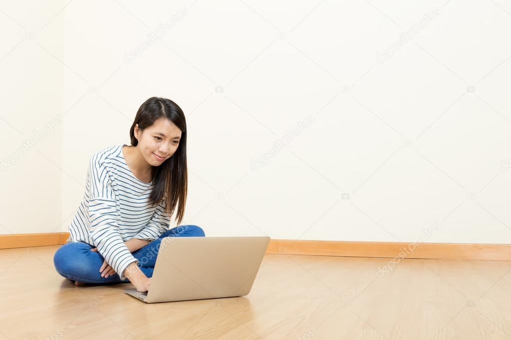 Asia woman using computer at home
