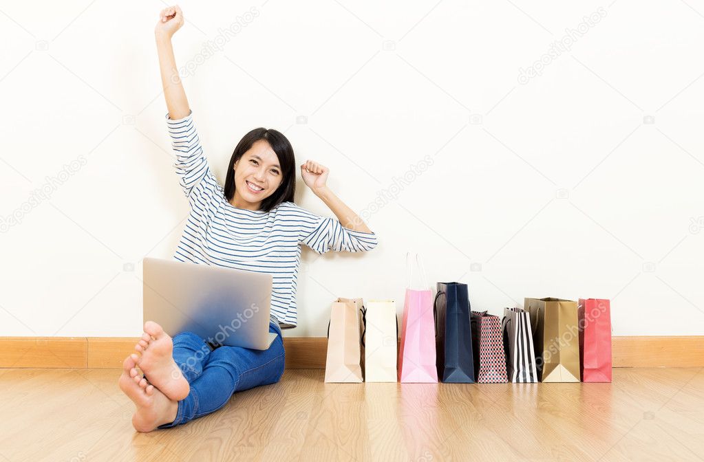 Asia womwn excited about shopping online