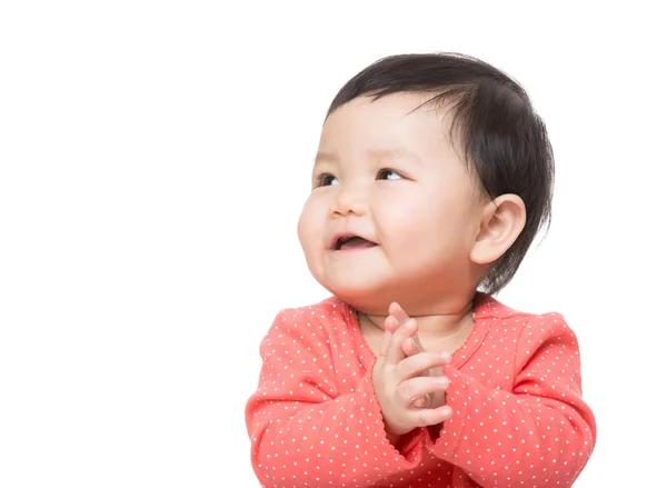 Asiatisches Baby Mädchen klatscht in die Hand und schaut zur Seite — Stockfoto