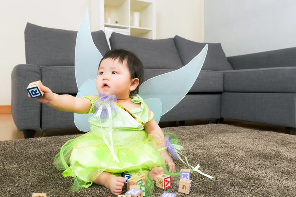 Asian baby girl with halloween party dressing and play toy block — Stock Photo, Image