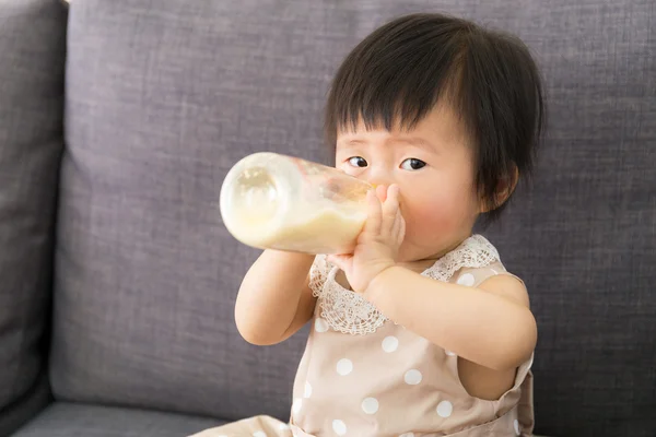 Asian baby girl having milk — Stock Photo, Image