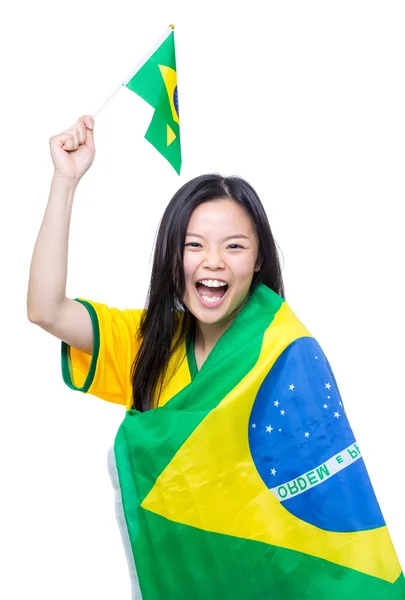 Upphetsad asiatiska kvinnliga fotboll supporter håller liten Brasilien flagga — Stockfoto