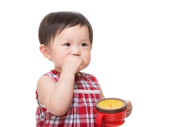 Asian little girl eating snack — Stock Photo, Image