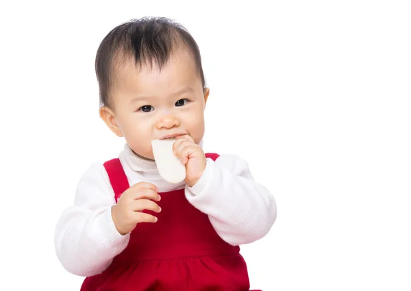 Asian baby girl eating biscuit — Stock Photo, Image