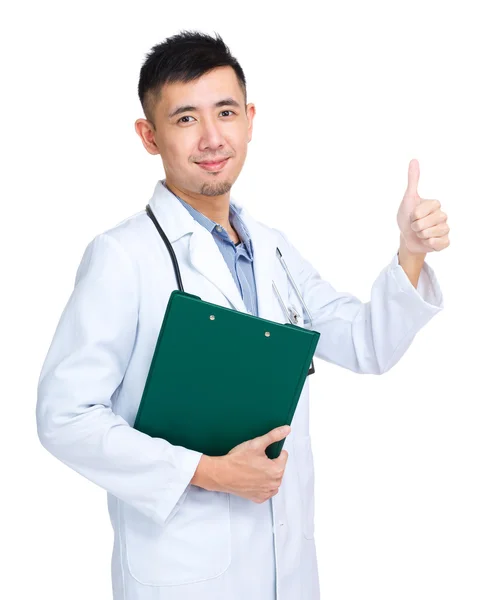 Young doctor with clipboard and thumb up — Stock Photo, Image