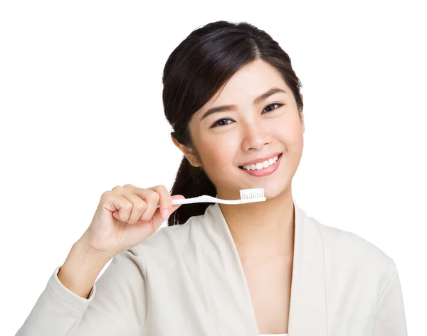 Woman holding toothbrush and smile — Stock Photo, Image