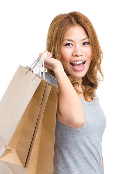 Usmívající se žena s nákupní taškou — Stock fotografie