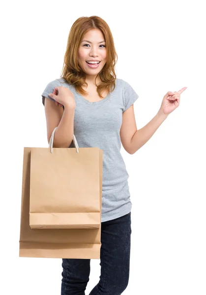 Mädchen mit Einkaufstasche mit Zeigefinger — Stockfoto