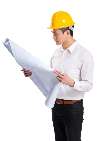 Construction workers looking at layout drawing — Stock Photo, Image