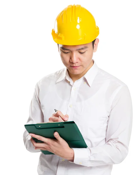 Foreman taking note on clipboard — Stock Photo, Image