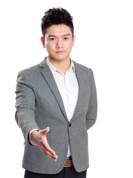 Successful businessman giving hand — Stock Photo, Image