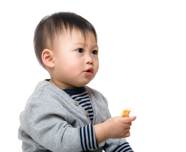 Menino comendo biscoito — Fotografia de Stock