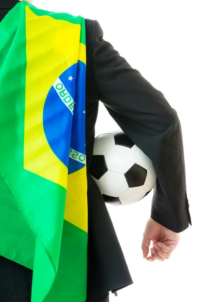 Visão traseira do homem de negócios com bola de futebol e bandeira do brasil — Fotografia de Stock