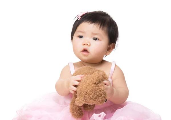 Lovely little girl holding doll — Stock Photo, Image