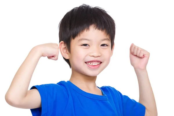 Liten pojke visar hand biceps muskler — Stockfoto