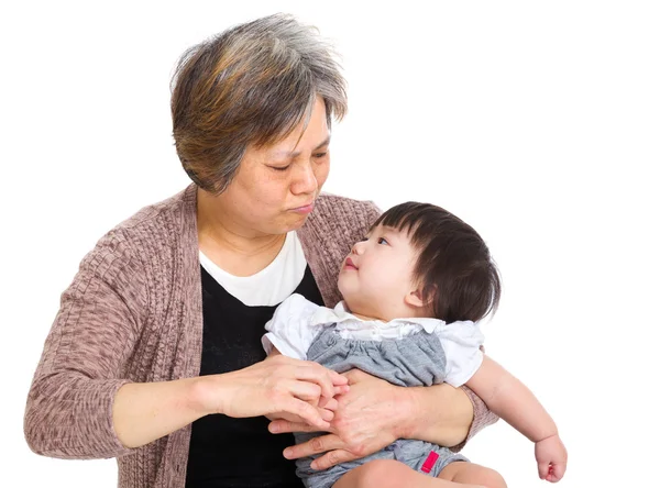 Grandmother looking at her granddaughter — Stock Photo, Image