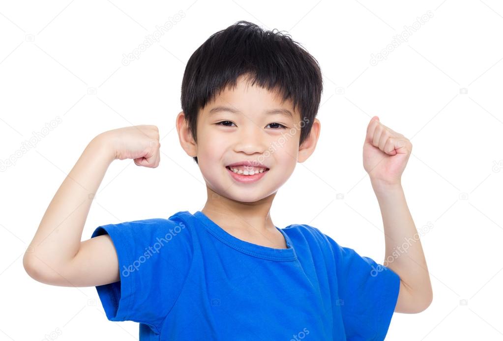 Asia little boy flexing biceps