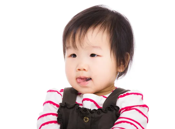 Asian bay girl lick sticking out — Stock Photo, Image