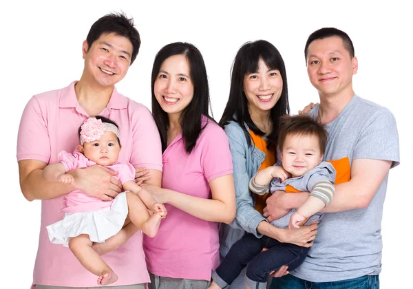 Twee gelukkige familie met baby — Stockfoto