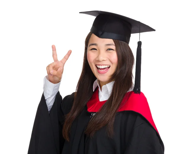 Щаслива аспірантка Азії зі знаком перемоги — стокове фото