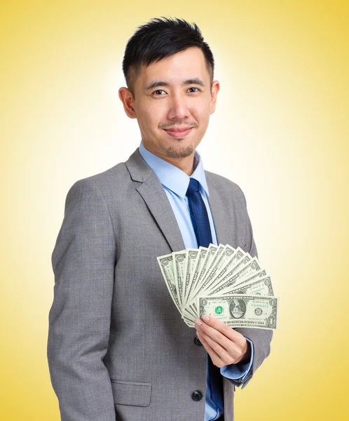 Businessman holding lots of cash — Stock Photo, Image
