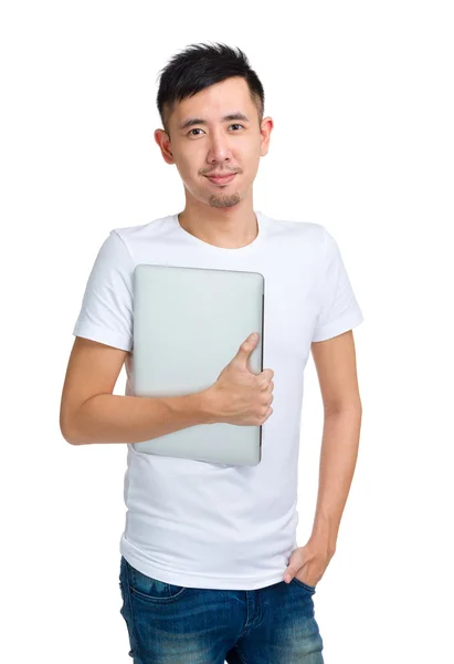 Asian young man with computer — Stok fotoğraf