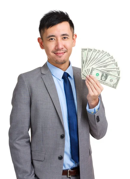 Businessman holding spread of cash — Stock Photo, Image