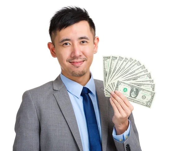 Businessman holding spread of money — Stock Photo, Image