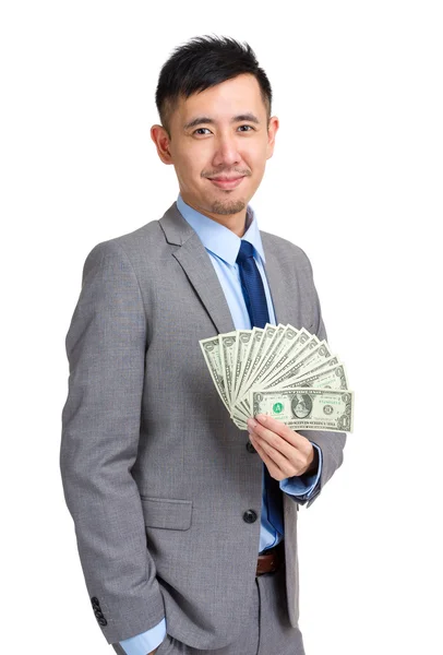 Biznesmen gospodarstwa pieniądze — Zdjęcie stockowe