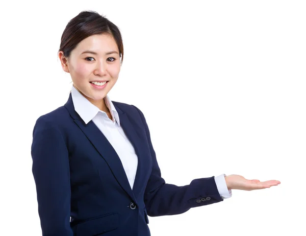 Businesswoman showing somthing on hand — Stock Photo, Image