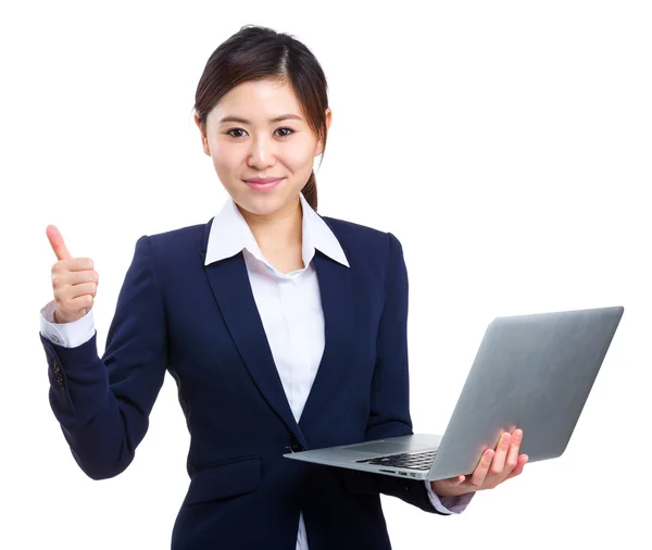 Businesswoman holding laptop with thumb up — Stock Photo, Image