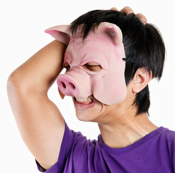 Muž prase maskou s bolestí hlavy頭痛と豚のマスクをかぶっている男 — Stock fotografie