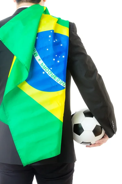 Vista posterior del empresario sosteniendo pelota de fútbol y bandera de Brasil —  Fotos de Stock