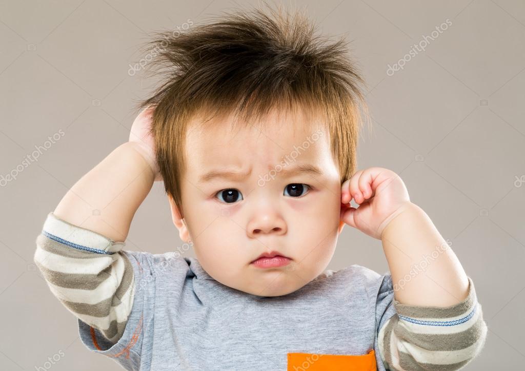 Baby boy feeling confused Stock Photo by ©leungchopan 46851529