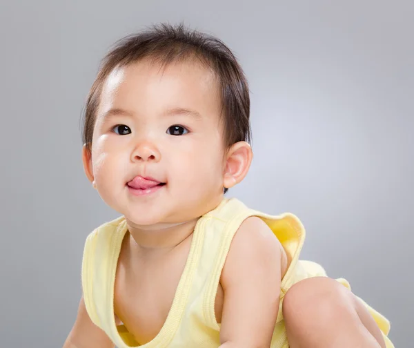 Baby showing naughty face — Stock Photo, Image